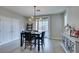 Inviting dining area with modern lighting and access to the backyard, perfect for seamless indoor-outdoor living at 3829 Hawkeye Falls Ave, North Las Vegas, NV 89085