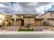 Attractive two-story home with a three-car garage, stone accents, and a well-manicured lawn at 3829 Hawkeye Falls Ave, North Las Vegas, NV 89085