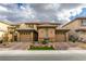 Charming home featuring a private courtyard entrance, two-car garages, and tasteful desert landscaping at 3829 Hawkeye Falls Ave, North Las Vegas, NV 89085