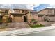 Charming two-story home featuring a three-car garage, brick driveway, and manicured front yard at 3829 Hawkeye Falls Ave, North Las Vegas, NV 89085
