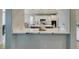 Open kitchen features marble countertops and backsplash, seamlessly connecting to the adjacent living spaces for easy entertaining at 3829 Hawkeye Falls Ave, North Las Vegas, NV 89085