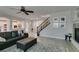 Expansive living room offering wood floors, staircase, gas fireplace and an open-concept design at 3829 Hawkeye Falls Ave, North Las Vegas, NV 89085