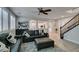 Spacious living room boasts wood floors, open layout, staircase access and plantation shutters at 3829 Hawkeye Falls Ave, North Las Vegas, NV 89085