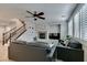 This airy living room offers wood floors, fireplace, staircase and plush seating for relaxation at 3829 Hawkeye Falls Ave, North Las Vegas, NV 89085