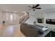 Light-filled living area with wood flooring, front door view, gas fireplace and an open layout at 3829 Hawkeye Falls Ave, North Las Vegas, NV 89085
