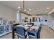 Open-concept space featuring a dining area and modern kitchen with bright lighting and seamless design at 3829 Hawkeye Falls Ave, North Las Vegas, NV 89085