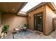 Private outdoor patio with pavers, outdoor lighting, sitting area and access to the house at 3829 Hawkeye Falls Ave, North Las Vegas, NV 89085