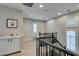 Upstairs landing with wood floors, plantation shutters, and built-in cabinets is a bright space at 3829 Hawkeye Falls Ave, North Las Vegas, NV 89085