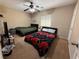 Bedroom featuring two beds, ceiling fan and window at 3844 Hollycroft Dr, North Las Vegas, NV 89081