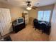 Bedroom featuring boxes, desk and ceiling fan at 3844 Hollycroft Dr, North Las Vegas, NV 89081