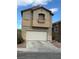 Two story home featuring a two car garage and stucco exterior at 3844 Hollycroft Dr, North Las Vegas, NV 89081