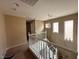 Hallway with overhead lighting and white banister at 3844 Hollycroft Dr, North Las Vegas, NV 89081