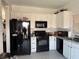 Bright kitchen featuring white cabinets, modern appliances, and tiled floors at 3844 Hollycroft Dr, North Las Vegas, NV 89081