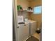 Laundry room featuring washer, dryer, shelf and window at 3844 Hollycroft Dr, North Las Vegas, NV 89081