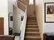 Carpeted staircase with white railing, and neutral paint at 3844 Hollycroft Dr, North Las Vegas, NV 89081