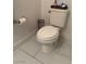 Close up of the toilet in the half bathroom, featuring tiled floors at 3844 Hollycroft Dr, North Las Vegas, NV 89081
