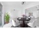 Eat-in dining area with round table set for four and views to living room at 3911 Chutney St, Las Vegas, NV 89121