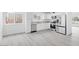 Bright kitchen featuring new appliances and sleek floors at 3911 Chutney St, Las Vegas, NV 89121