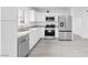 Bright kitchen features stainless appliances, ample counter space, and sleek white cabinetry at 3911 Chutney St, Las Vegas, NV 89121