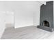 Bright living room featuring a gray brick fireplace and sleek floors at 3911 Chutney St, Las Vegas, NV 89121