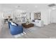 Open floor plan features a modern living room flowing into the kitchen at 3911 Chutney St, Las Vegas, NV 89121