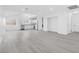 Bright living room with sleek floors leading into the kitchen at 3911 Chutney St, Las Vegas, NV 89121