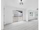 Bright, open living area features sleek flooring and neutral decor at 3911 Chutney St, Las Vegas, NV 89121