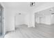 Open living area featuring modern lighting, sleek floors, and neutral paint at 3911 Chutney St, Las Vegas, NV 89121