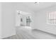 Bright and open living area with modern lighting and sleek flooring at 3911 Chutney St, Las Vegas, NV 89121