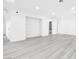 Bright living room with sleek floors and doorways leading to the bathroom at 3911 Chutney St, Las Vegas, NV 89121