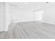 Bright living room with sleek floors leading to hallways and doorways at 3911 Chutney St, Las Vegas, NV 89121