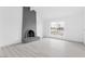 Bright living room with a brick fireplace and a window at 3911 Chutney St, Las Vegas, NV 89121