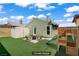 This backyard offers ample room to play with a playground set, fire pit, and shed for storage at 4156 Broadriver Dr, Las Vegas, NV 89108
