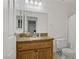 Bathroom vanity featuring granite countertop and wooden cabinets at 4156 Broadriver Dr, Las Vegas, NV 89108