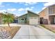 Inviting one-story home featuring an attached garage, bay window, and low-maintenance desert landscaping at 4156 Broadriver Dr, Las Vegas, NV 89108