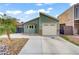 Inviting one-story home featuring an attached garage, bay window, and low-maintenance desert landscaping at 4156 Broadriver Dr, Las Vegas, NV 89108