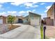 Charming single-story home featuring an attached garage, desert landscaping, and a private gated courtyard at 4156 Broadriver Dr, Las Vegas, NV 89108