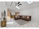 Open living area and kitchen features vaulted ceilings, tile flooring, and comfortable seating at 4156 Broadriver Dr, Las Vegas, NV 89108