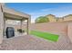 Backyard boasts a covered patio with ample seating, low-maintenance landscaping, and a privacy wall at 4224 Galapagos Ave, North Las Vegas, NV 89084