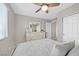 Bedroom with white furniture, a ceiling fan, and natural light from the window at 4224 Galapagos Ave, North Las Vegas, NV 89084