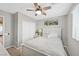 Inviting bedroom with a white bed, ceiling fan, and closet at 4224 Galapagos Ave, North Las Vegas, NV 89084