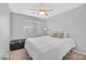 Bright bedroom with a ceiling fan, window, and a comfortable bed at 4224 Galapagos Ave, North Las Vegas, NV 89084