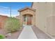 Charming front entrance with stone accents, desert landscaping and a secure front door at 4224 Galapagos Ave, North Las Vegas, NV 89084