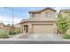 Two-story home featuring a large garage, desert landscaping and attractive stone accents at 4224 Galapagos Ave, North Las Vegas, NV 89084