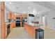 Modern kitchen with stainless steel appliances, tile floors, and an island for extra workspace at 4224 Galapagos Ave, North Las Vegas, NV 89084
