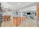 Bright, open kitchen featuring a large island, dining area, and seamless flow into the living room at 4224 Galapagos Ave, North Las Vegas, NV 89084