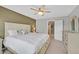 Spacious main bedroom with a ceiling fan and a neutral color scheme to inspire relaxation at 4224 Galapagos Ave, North Las Vegas, NV 89084