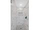 Close-up of a modern glass-enclosed shower with decorative tile and a mosaic tile floor at 4224 Galapagos Ave, North Las Vegas, NV 89084