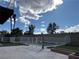 Backyard featuring a well-maintained pool with secure fencing, decorative concrete patio, and palm trees at 4417 De Forest St, Las Vegas, NV 89103
