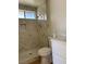 Bathroom showcasing a tiled shower, modern fixtures, and stylish herringbone pattern drain at 4417 De Forest St, Las Vegas, NV 89103